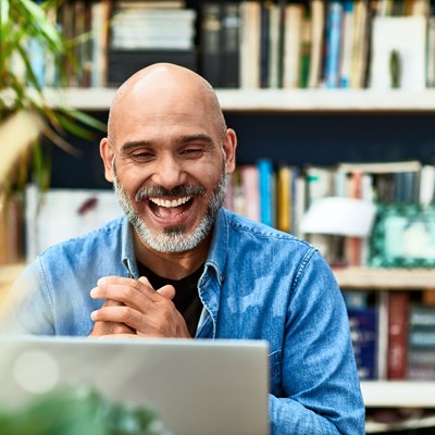 Man smiling in online meeting 